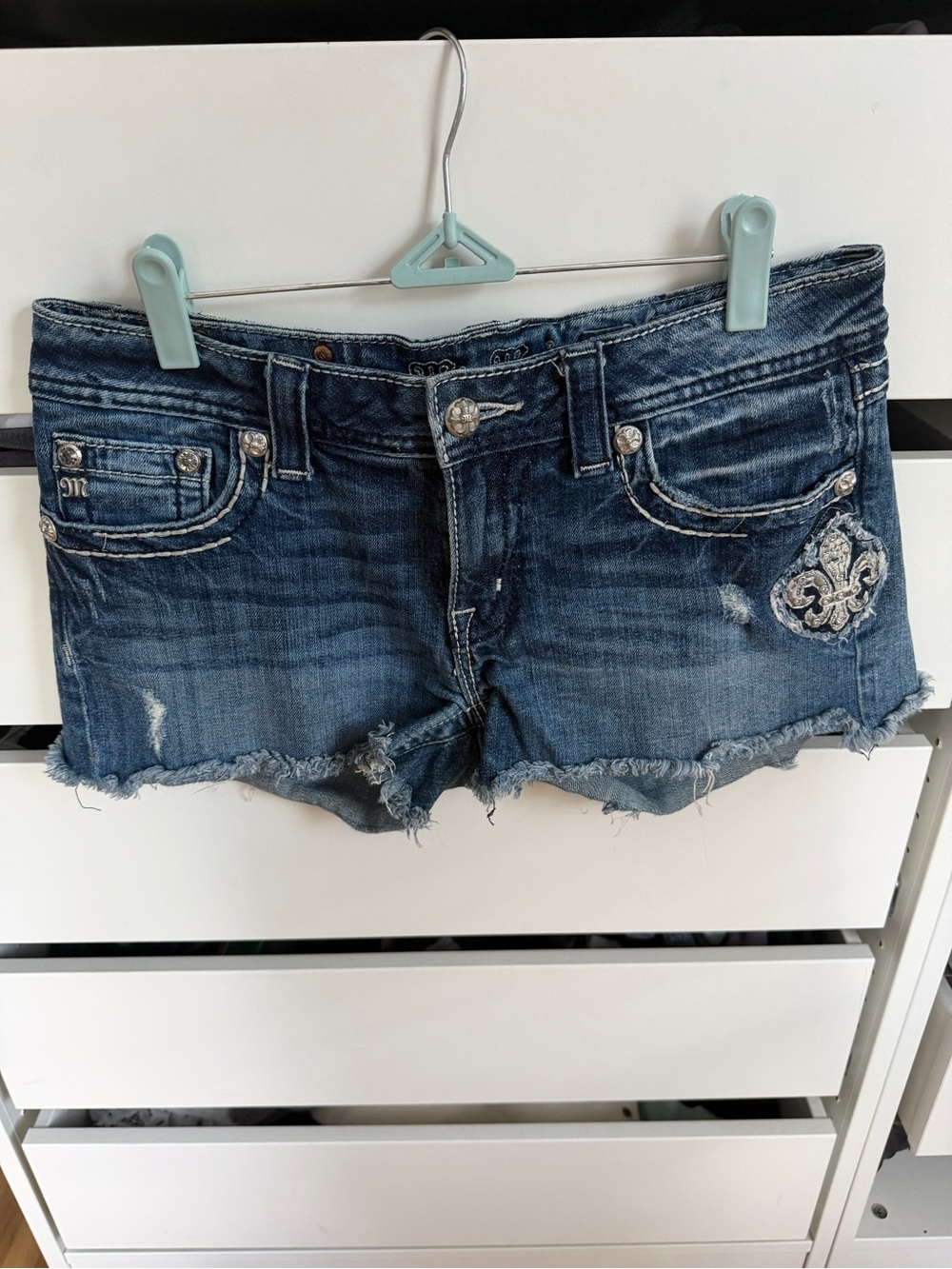 Miss Me Distressed Blue Denim Shorts with Embroidered Fleur-de-Lis